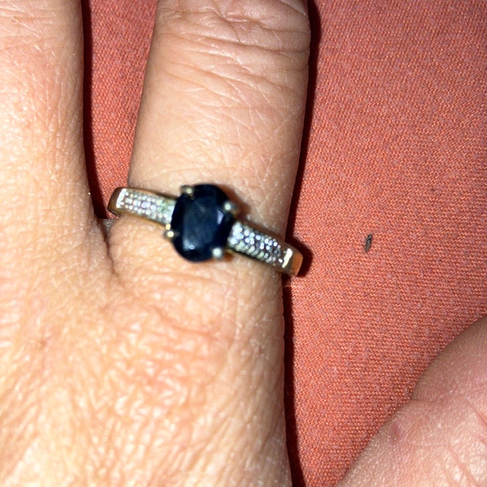 Gold plated ring with black stone and cubic zirconium diamonds on both sides